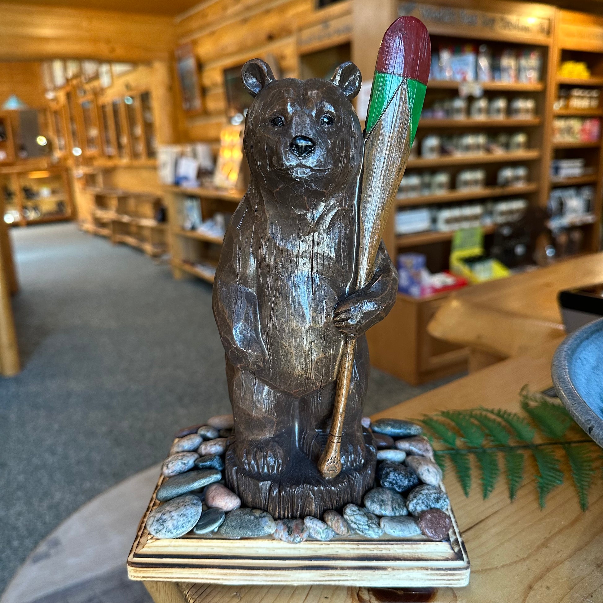 BEAR W/PADDLE STATUE